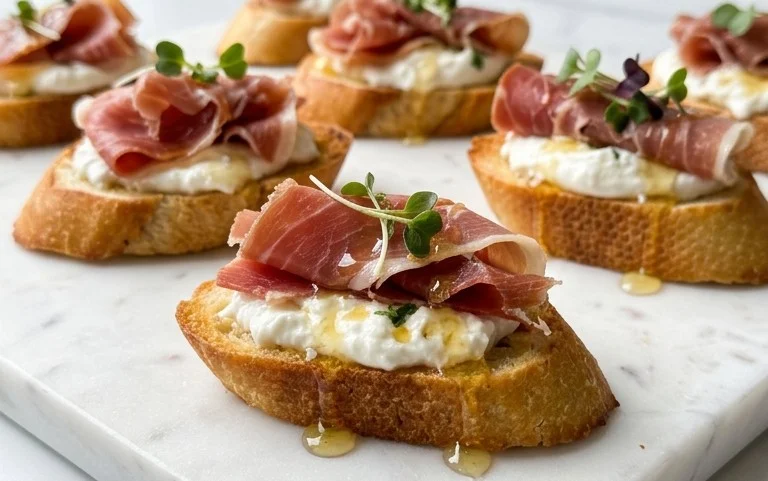 Beef Prosciutto Crostini with Burrata and Lemon Honey Drizzle